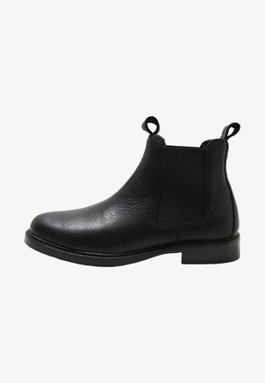 Botte Chelsea en cuir noir avec panneau latéral élastique, languettes à l'avant et à l'arrière, talon bas et bout arrondi.