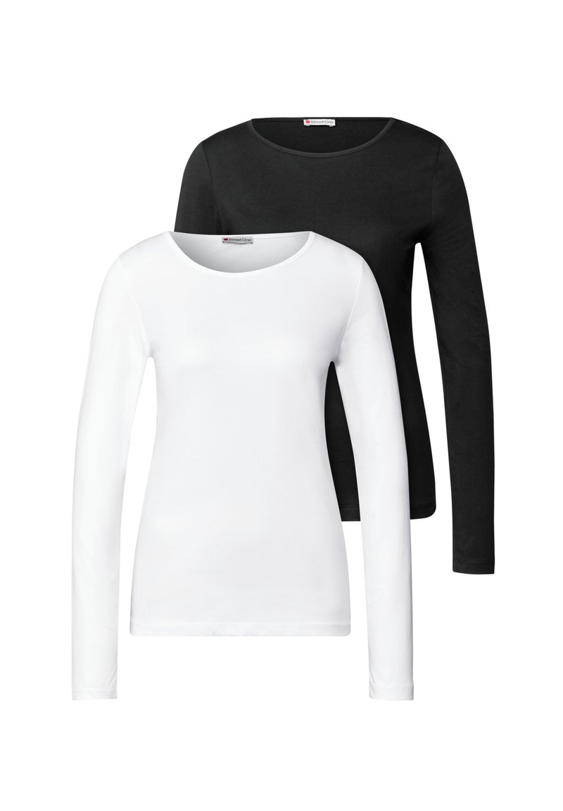 Deux chemises à manches longues : une blanche et une noire, toutes deux en coton lisse avec des encolures rondes et des silhouettes ajustées.