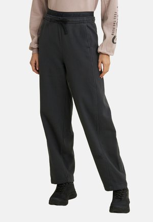 Pantaloni della tuta grigio scuro con vita elasticizzata, coulisse e tasche laterali. Accenti del logo vicino all'orlo e in vita per un tocco di dettaglio in più.