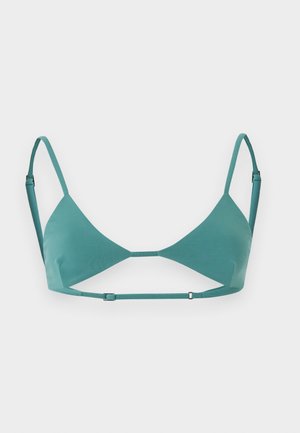 Soutien-gorge triangle bleu sarcelle avec bretelles réglables aux épaules et sous la poitrine, avec un design minimaliste et un tissu lisse.