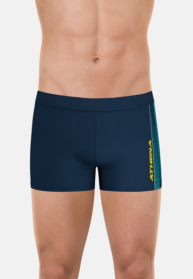 Shorts de bain bleu marine avec une coupe ajustée, arborant un logo jaune et un motif vertical texturé turquoise sur le côté.
