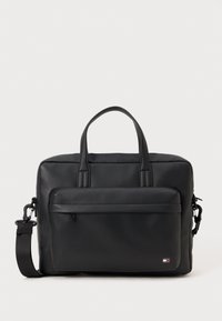 Black laptop bag made of smooth synthetic material with textured front panel, dual handles, adjustable strap, and logo accent on the lower front.