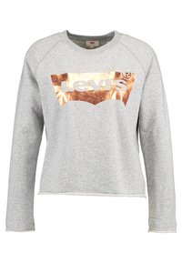 Sweat-shirt gris à manches longues avec une coupe courte. Présente un logo Levi's métallique en or rose sur le devant. Tissu doux et texturé.