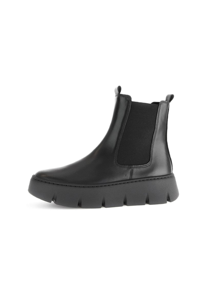 Bottines Chelsea en cuir noir avec des panneaux latéraux élastiques, un bout arrondi et une semelle en caoutchouc épaisse et texturée.