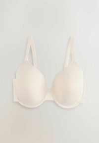 Soutien-gorge rembourré couleur crème avec bretelles ajustables et armatures, posé à plat sur un fond clair.
