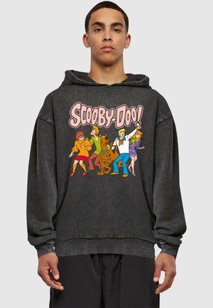 Black hoodie featuring a colorful "Scooby-Doo!" graphic with characters: Velma, Shaggy, Scooby, Fred, and Daphne. Soft texture, relaxed fit.