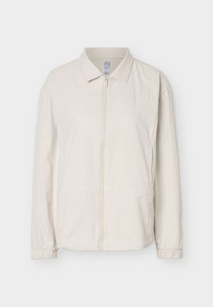 Cream-colored lightweight jacket with collar, front zipper, long sleeves, and elastic cuffs, displayed on a white background.