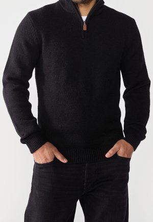 Stickad tröja - black