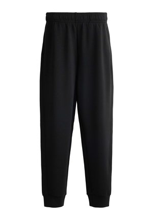 Svarta sweatpants med resårmidja, avsmalnande ben och ribbade muddar. Tillverkade av mjukt tyg och har sid sömmar för extra detalj.