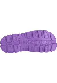 Purple rubber shoe sole with textured surface, featuring multi-directional lugs for traction and raised brand name along the center.