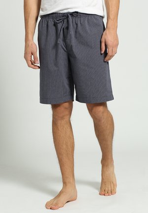 Marinrandiga shorts med elastisk dragsko i midjan, sidofickor och en avslappnad passform som slutar strax ovanför knäet. Tillverkade av lättviktsmaterial.