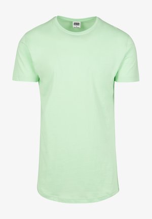 Minti roheline puuvillane T-särk ümarate kaelustega, lühikeste varrukatega ja sirge hemiga; sile tekstuur ja minimalistik disain.