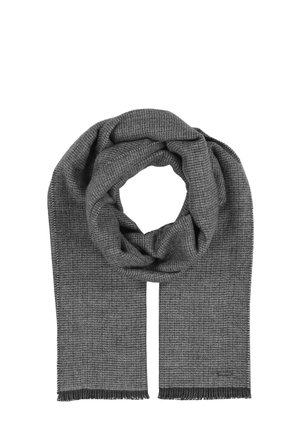 Gray woven scarf featuring a textured pattern with fringed edges, draped in a circular shape. Soft material with a smooth finish.