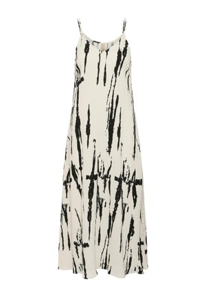 Lange witte spaghetti band jurk met zwarte abstracte verticale penseelstreekpatronen en een vloeiende silhouet.