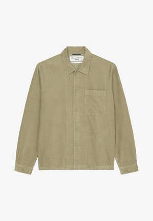 Košilová bunda z olivově zeleného manšestru s límečkem, dlouhými rukávy, zapínáním na knoflíky vpředu a jednou náprsní kapsou. Texturovaná tkanina a rovný lem.
