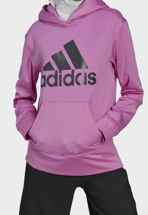Rosa huvtröja med en stor svart Adidas-logotyp, med en framficka och långa ärmar. Slät textur och atletisk passform.
