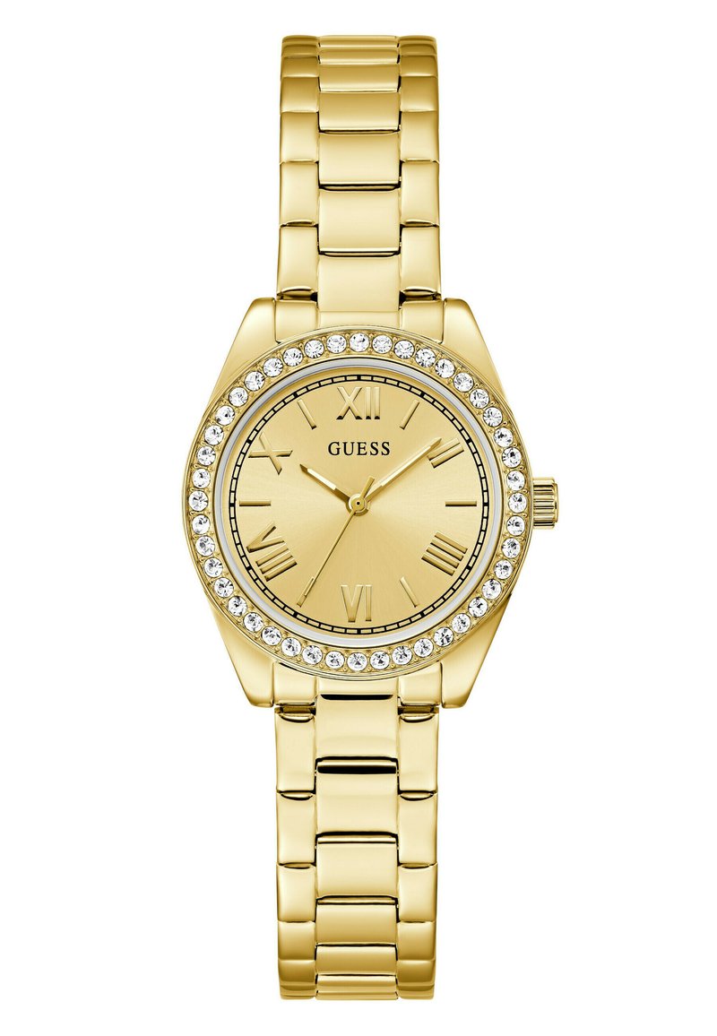 Montre dorée avec un cadran rond, des chiffres romains et une lunette sertie de cristaux. Elle dispose d'un bracelet en métal maillé avec une finition polie.