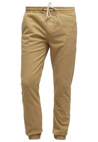 Herrars khaki joggerbyxor med elastisk midja, vit dragsko, sidofickor och elastiska ärmslut vid anklarna.