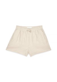 Shorts en lin beige avec taille élastique, cordon de serrage et poches latérales, disposés à plat sur un fond blanc.