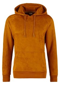 Sudadera con capucha de color mostaza hecha de material suave, con un bolsillo tipo canguro, cordones y puños y dobladillo acanalados.