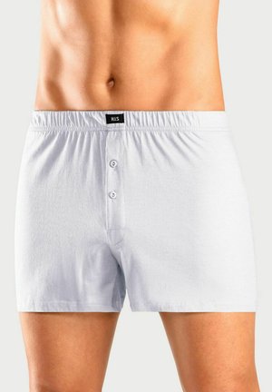 Light gray cotton boxer shorts feature a front button closure, elastic waistband, and logo tag at the waistband. Smooth texture and casual design.