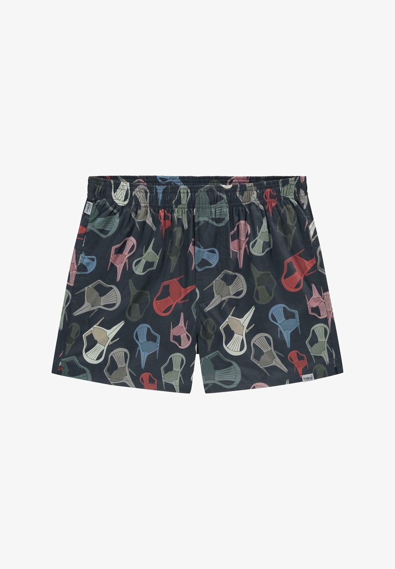 Shorts de bain courts en tissu léger avec un fond bleu marine et des chaises multicolores de différentes formes et tailles. Taille élastique.