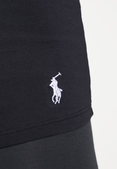Black cotton t-shirt featuring a white embroidered polo player logo on the left side, smooth texture with a fitted design.
