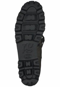 Semelle de chaussure en caoutchouc noir avec un motif de grip texturé, présentant un logo prominent au centre et des sections contournées pour une meilleure traction.