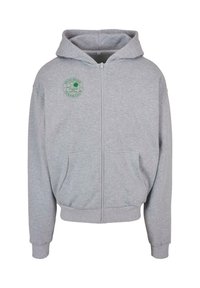 Pelēks zip-up d�žemperis, kas izgatavots no mīksta auduma, ar apaļu zaļu logo kreisajā krūtī un divām priekšējām kabatām. Ribotas muskuļu un apakšmalas.