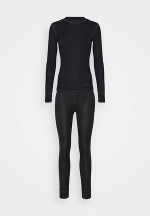 Zwarte thermische top met lange mouwen en bijpassende leggings. Gemaakt van gladde, elastische stof met een aansluitend ontwerp en contrasterende grijze stikselaccenten.