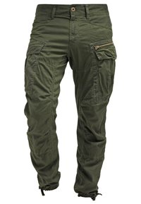 Pantaloni cargo in verde oliva, realizzati in tessuto resistente, con numerose tasche, dettagli con zip, polsini elasticizzati e una vestibilità comoda.