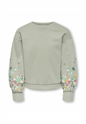 Sweat-shirt vert sauge clair avec manches longues bouffantes ornées de broderies florales multicolores le long des avant-bras.