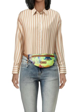 Multicolored fanny pack with abstract patterns, featuring a front zip pocket and a brown leather belt. Paired with a striped shirt and denim.