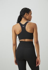 Puma 4KEEPS SHAPELUXE SEAMLESS - Sujetadores deportivos con sujeción media - black