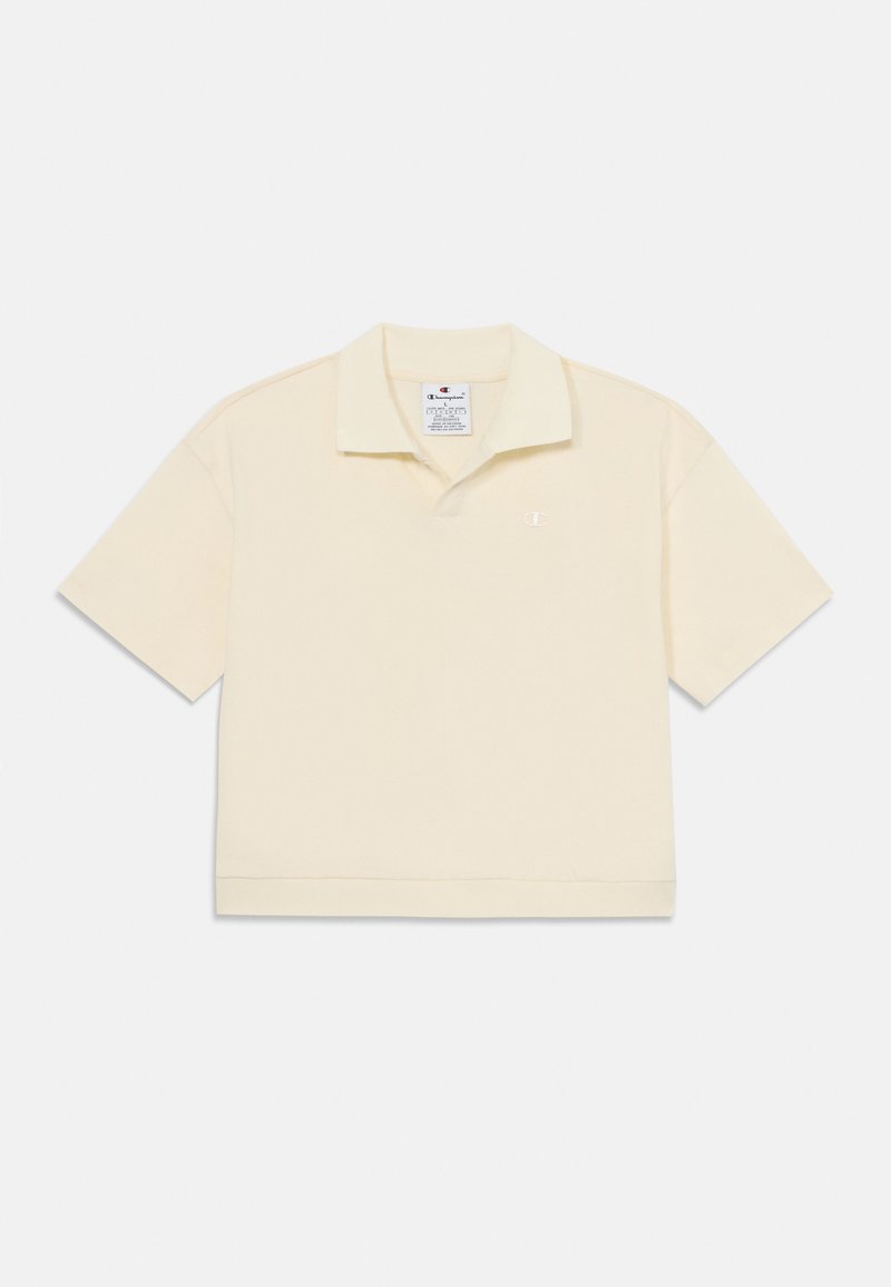 Polo tričko s krátkym rukávom z mäkkej, svetložltej látky. Má klasický golier, rovný lem a malé vyšívané logo na hrudi.