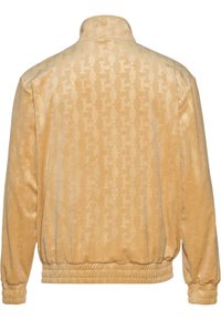 Karl Kani CHEST SIGNATURE MONOGRAM VELVET - Sportinė striukė - sand