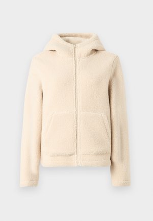 Κρεμ φλις φούτερ με φερμουάρ, επενδεδυμένη κουκούλα, τσέπες καγκουρό και ριμπ μανσέτες. Μαλακή υφή και απλός σχεδιασμός χωρίς σχέδια.