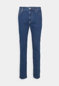 Mörkblå denimjeans med rak benstil, klassisk femficksdesign, framknapp och dragkedjestängning samt subtila stygn detaljer.