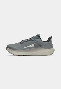 Gray running shoe with a breathable mesh upper, cushioned sole, reflective accents, and a light gray outsole with orange detailing.