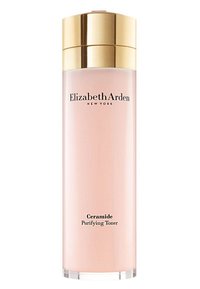 Klar glasflaska med ett guldlock, som inneh åller rosa vätsketoner. Har svart text: "Elizabeth Arden" och "Ceramide Purifying Toner."