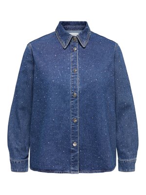 Tumši zila džinsa krekls ar plankumu rakstu. Aprīkots ar pogām aizdarāmu priekšpusi, apkakli, garām piedurknēm un sudraba krāsas aksesuāriem.