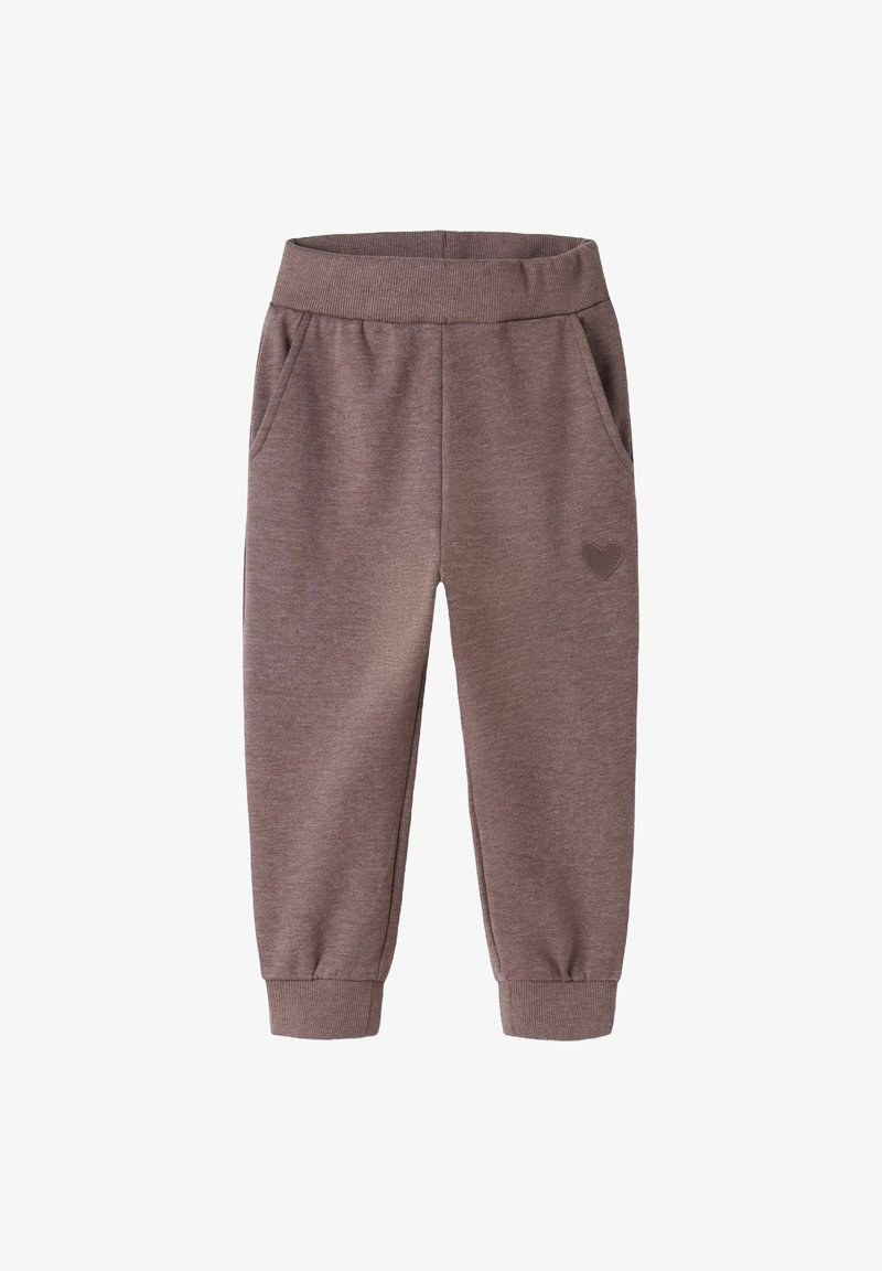 Brown sweatpants with a soft texture, elastic waistband, cuffed ankles, and two side pockets. Features a small heart emblem on the left side.