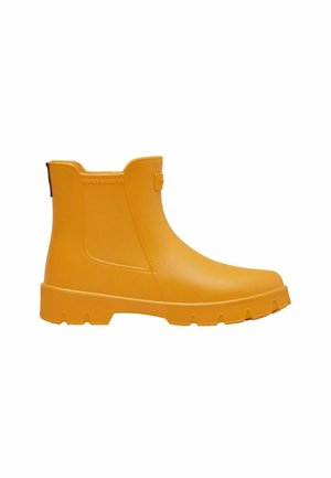 Yellow ankle-length rubber rain boot with textured sole and elastic side panels for easy wear, shown in side view on white background.