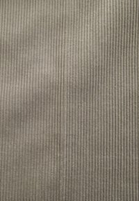 Gray ribbed fabric with vertical lines, soft texture, and medium thickness. Fabric features a subtle sheen and a consistent pattern throughout.