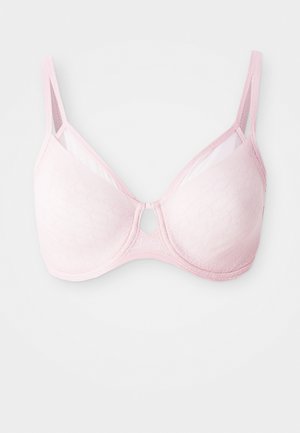 Light pink bra with semi-sheer fabric, a geometric pattern, underwire support, adjustable straps, and a small center keyhole detail.
