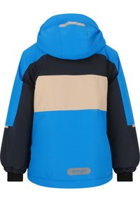 Sininen, beige ja laivastonsininen väri-eroilla varustettu takki hupulla, elastisilla hihansuilla ja logopatchilla helmassa. Valmistettu sileästä, vettä hylkivästä materiaalista.