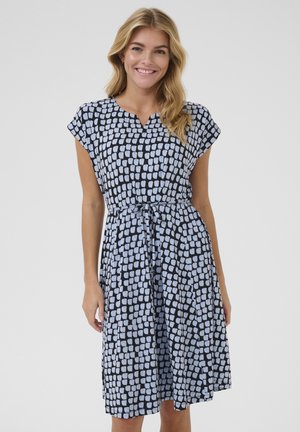 Patterned knee-length dress in black and light blue, featuring cap sleeves, a tie belt, and a V-neckline. Lightweight fabric with a relaxed fit.