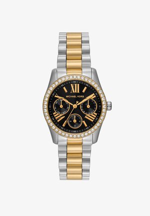 Orologio Michael Kors con quadrante nero, bracciale in metallo con maglie oro e argento, lunetta con cristalli e tre subquadranti. Numero romano XII alle 12.