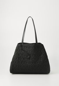 Black quilted tote bag with floral pattern, flat base, and two shoulder straps. Includes a rectangular tag attached to the handle.