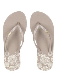 Roxy flip-flops i lys tan med tekstureret mønster, udstyret med brune stropper og hvide blomsterdetaljer på indersiden.